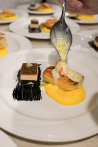 Crave Culinaire plating a dish at a Crave for a Cause event in Naples Florida