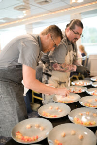 Chef Brian Roland and team prepare dishes at Crave for a Cause